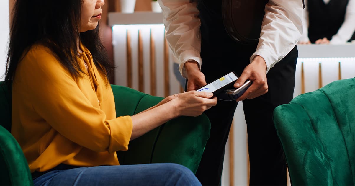 Hotel room with luggage and travel documents on bed